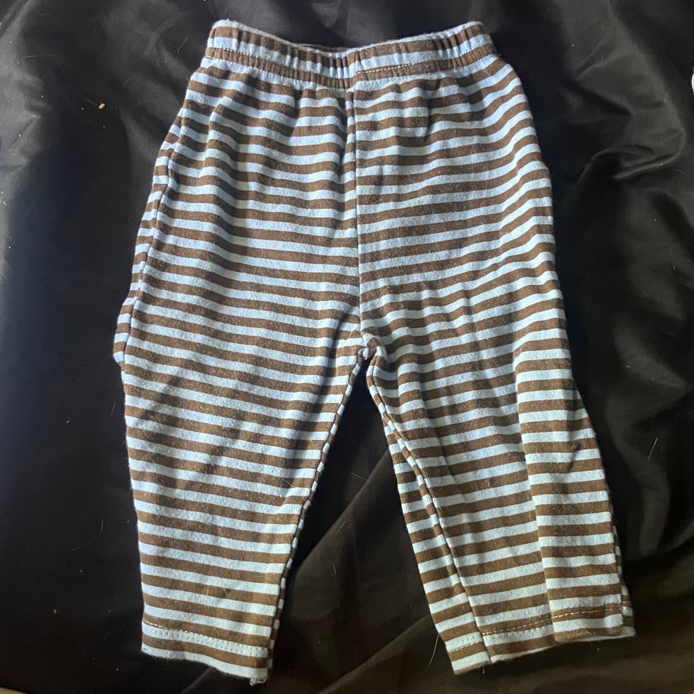 Brown and blue striped pants with a cookie on the butt.